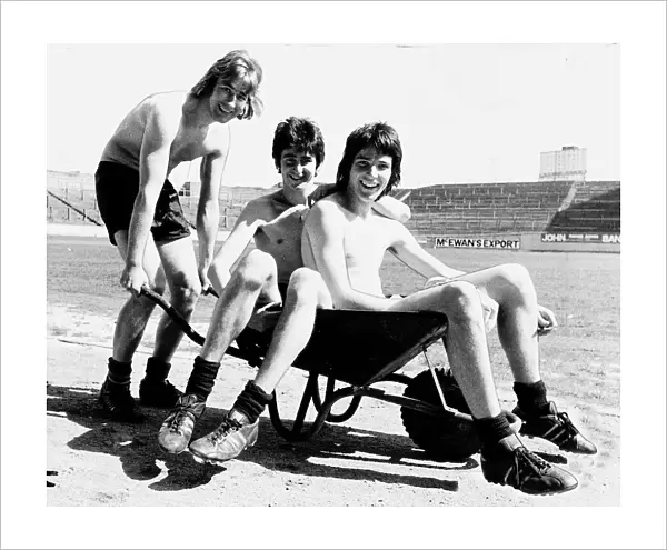 Partick Thistle football players Rough Houston and Hansen playing with wheelbarrow