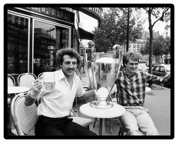 Liverpool players Phil Thompson and Alan Kennedy celebrate with the European Cup after