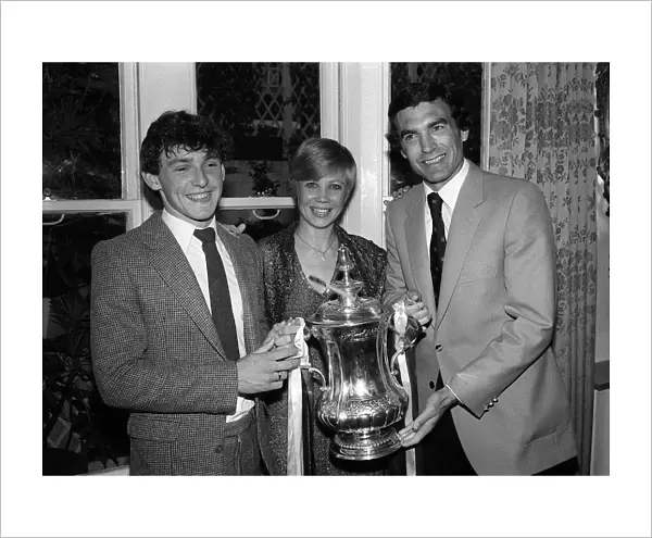 Seventeen years old Paul Allen poses with the FA Cup with Trevor Brooking