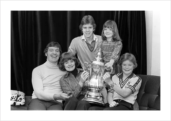 Laurie McMenemy football manager with his wife and children holding the FA Cup at