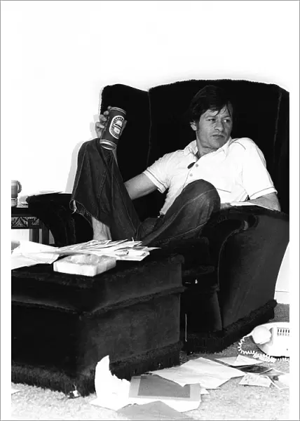 Alex Higgins World Snooker Champion 1982 sitting at home relaxing with a can of
