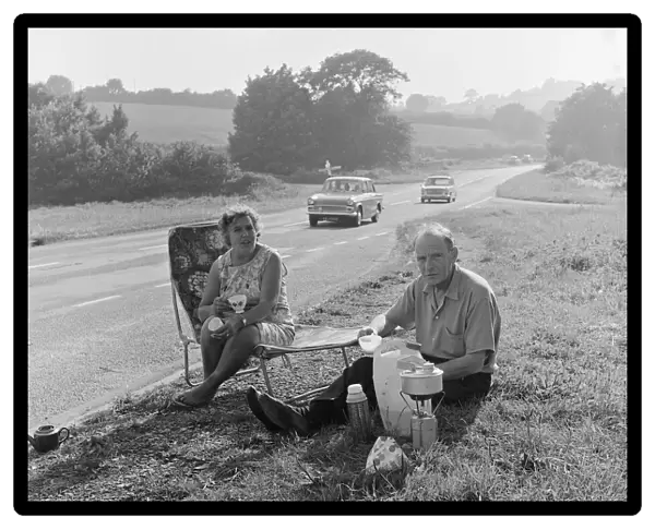 Tom and Lily Mattingly of Brentwood, Essex enjoy a picnic on the side of the main Newton