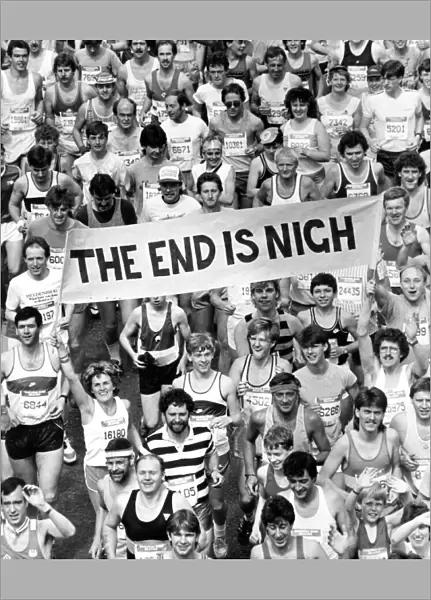 The Great North Run 30 June 1985 - Fun runners carrying a banner featuring the '