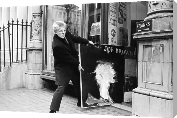 Singer Joe Brown collects a picture of himself from Portal Gallery, Grafton Street, W1