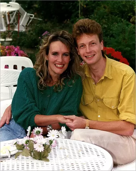 Mark Burgess Actor with wife Elizabeth sitting in a garden patio DBase