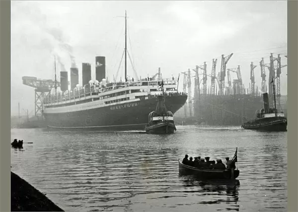 RMS Aquitania seen here being towed away from the John Brown shipyard on the River Clyde