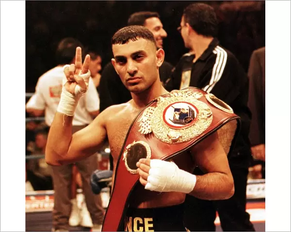 Prince Naseem Hamed gives victory sign after defeating Remigio Molina to retain his World