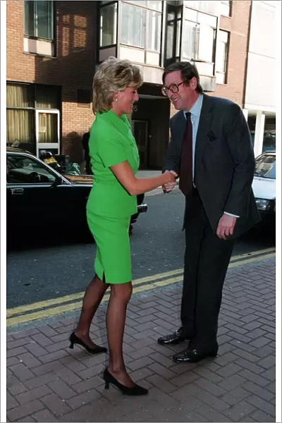 Diana, Princess of Wales is greeted by Max Hastings, Editor of the Evening Standard