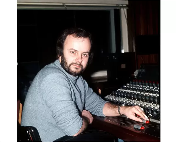 DJ John Peel in radio one studio sitting by mixing desk 1976 John Peel BBC Radio