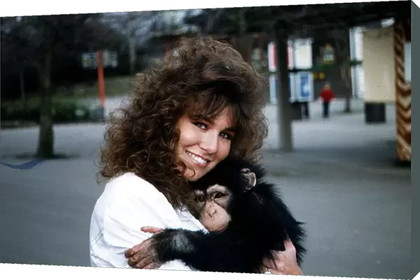 Linda Lusardi Model  /  TV Presenter holding baby monkey January 1990 A©mirrorpix