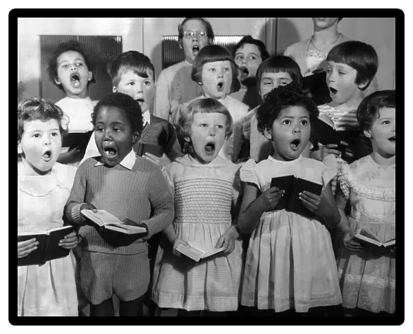 A choir of children sing at the Dr Barnados Farm Hill in Kelvedon Essex