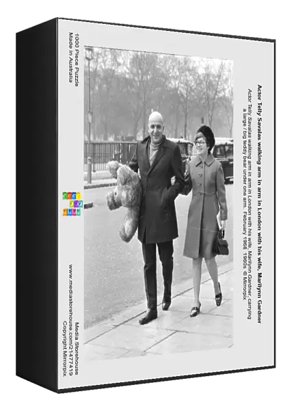 Actor Telly Savalas walking arm in arm in London with his wife, Marilynn Gardner