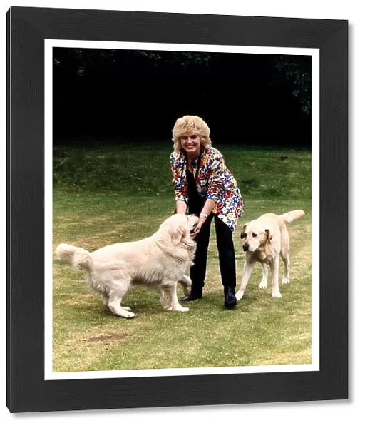 Gloria Hunniford TV Presenter at home with her dogs