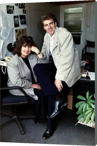 Jonathan Ross TV Presenter sitting on desk with his mother Maureen