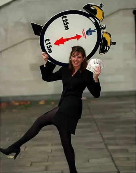 Carol Vorderman TV Presenter November 97 With a lottery clock which shows an arrow