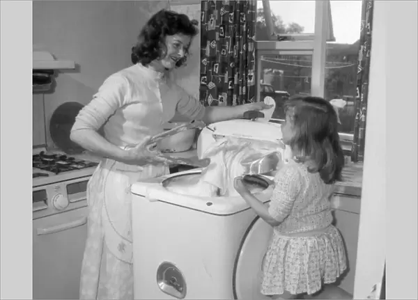 Little Christine Eccles likes to help her mother Doreen with the washing which is much