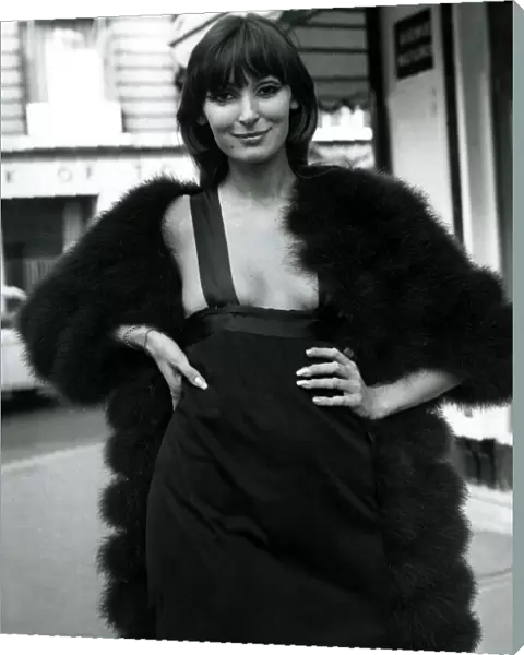 Fashion 1960s Model standing in a street in Paris wearing a mini skirt dress