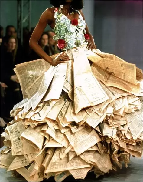 Naomi Campbell wearing a newspaper and money dress at the Clothing Brition Fashion Show