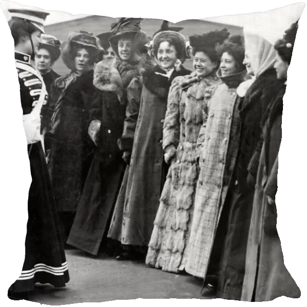 A group of ladies all wearing long coats and hats during an inspection for Whitehall