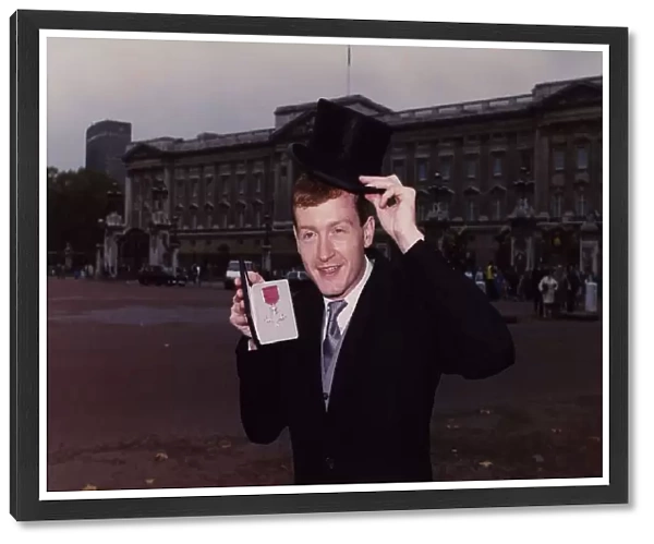 Steve Davis Snooker outside Buckingham Palace holding an award