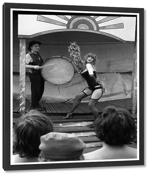 Actress Helen Mirren wearing a fishnet tights portraying character of fairground stripper