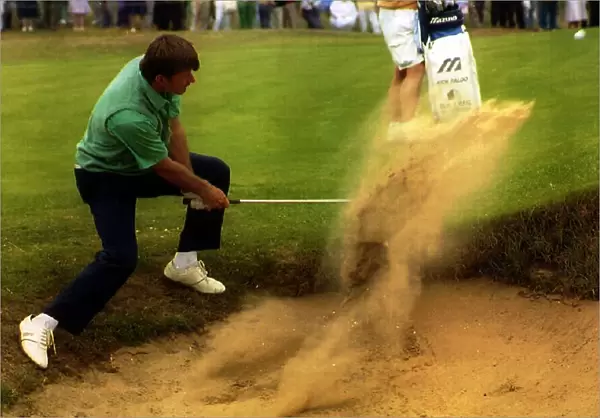 Nick Faldo. golfer chipping out of a bunker