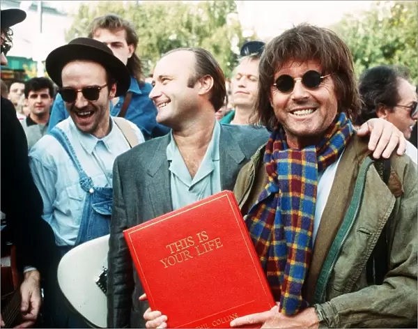 Michael Aspel TV Presenter surprises Phil Collins for the show This is your Life with