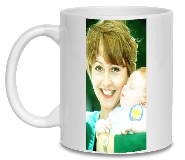 Anne Diamond TV Presenter holding Baby Michael O Conner Launching National Cot Death