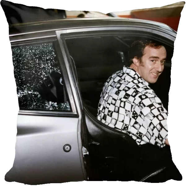 Angus Deayton Actor and TV Presenter gets into his car