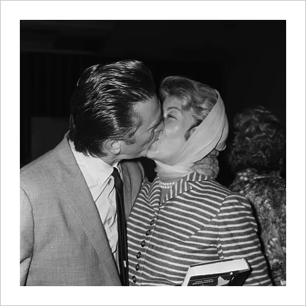 Actor Kirk Douglas at London Airport with his wife 1958