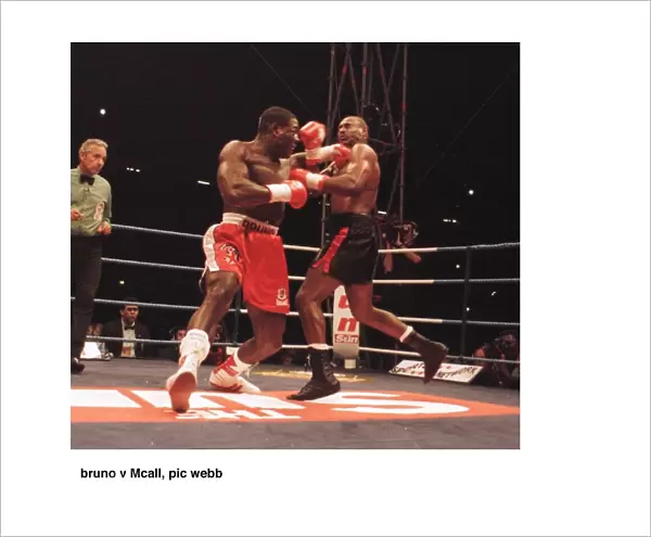 Frank Bruno lunges at Oliver McCall with a left Jab during their fight for