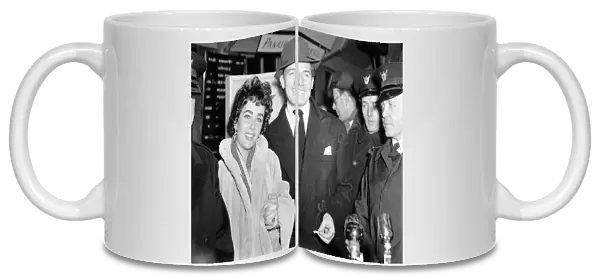 Elizabeth Taylor on arrival at the London Airport with Michael Wilding