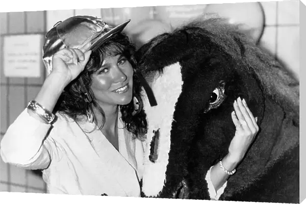 Linda Lusardi model actress standing with pantomime horse