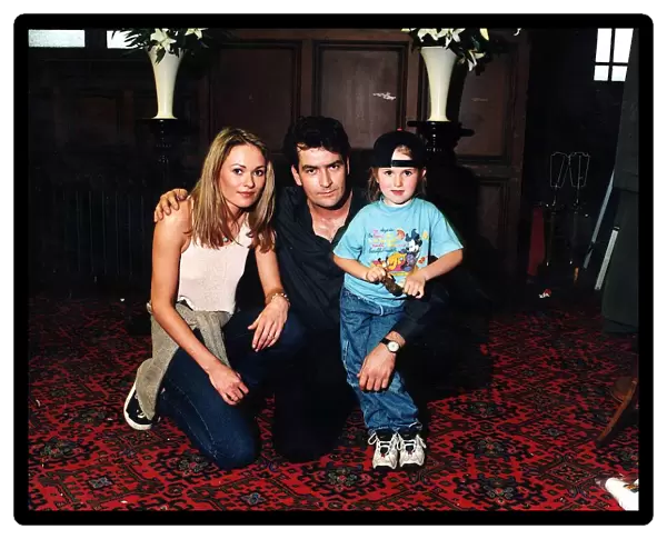 Charlie Sheen with Leandra Strand and daughter Tyla in August 1997