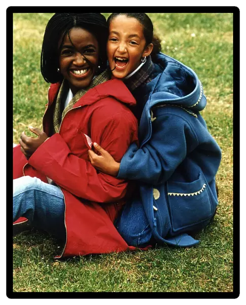 Diane Louise Jordan with young girl her niece Justine wearing blue jacket
