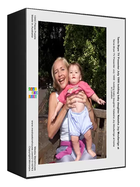 Tania Bryer TV Presenter July 1999 holding baby daughter Natasha Joy Moufarrige at