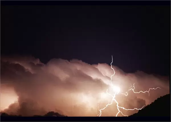 Lightning strikes from storm clouds in Umbria, Italy August 1996