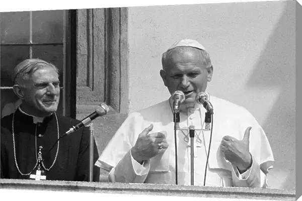 Pope John Paul II gives a blessing from a balcony during his visit to Ireland