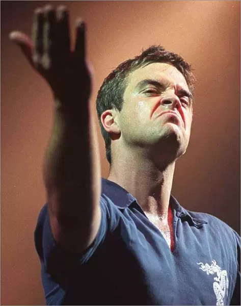 Robbie Williams makes a face to the audience at his concert at the SECC Glasgow February