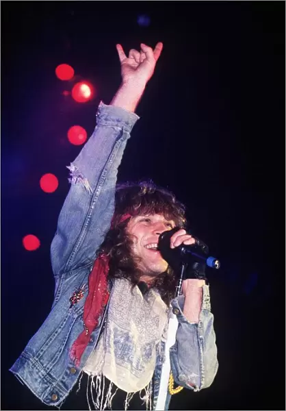 Jon Bon Jovi Pop Singer performing with band at Hammersmith Odeon in 1986