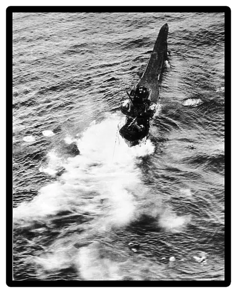 The crew of a sinking German U Boat scramble into the lifeboats after being hit by a