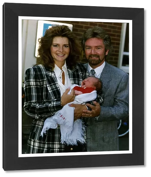 Noel Edmonds Tv Presenter with new born baby Olivia and wife Helen