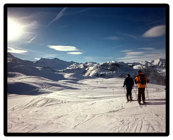 Skiers overlook the French Alps at Val D Isere February 1999