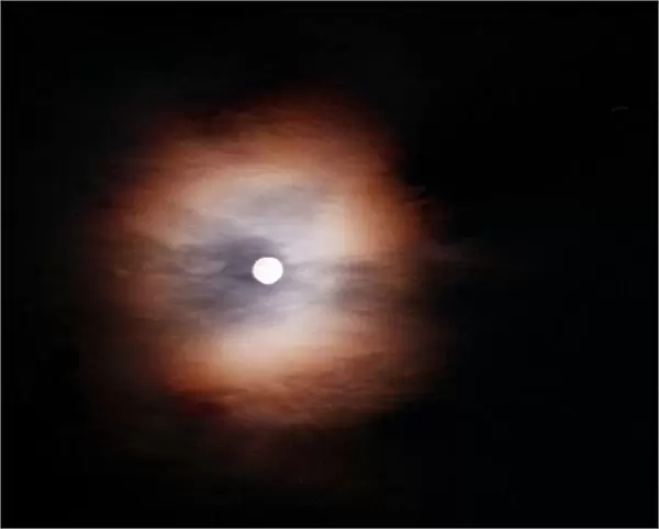 The Moon behind clouds in Italy August 1997