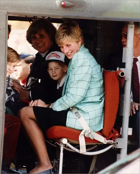 Princess Diana with Prince Harry and William board a Candian military helicopter after