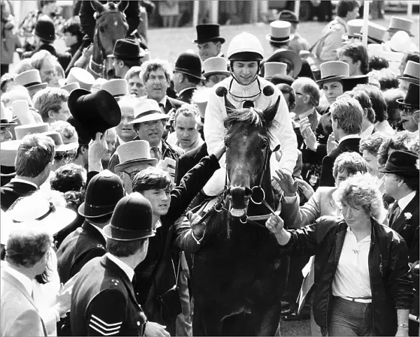 Reference Point with jockey Steve Cauthen being escorted to the winners enclosure after