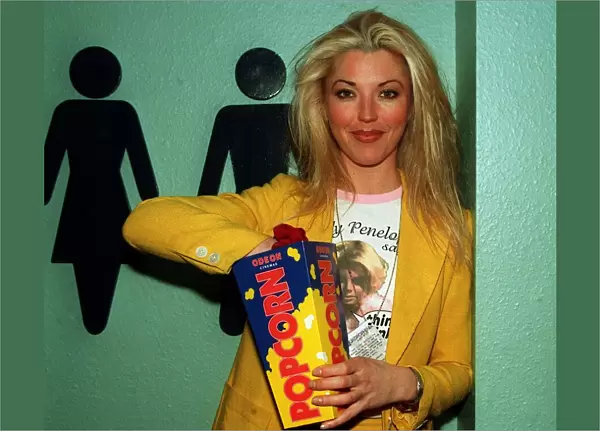 Tamara Beckwith model eating popcorn at film premiere circa May 1997