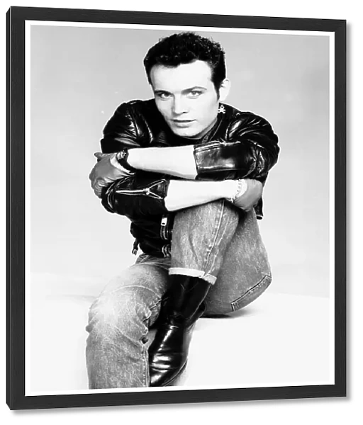 Adam Ant pop singer arms round leg jeans leather jacket Circa 1980