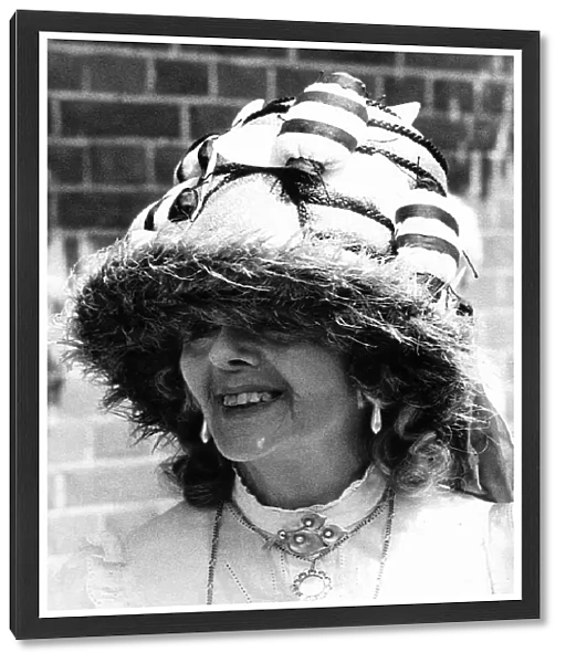 Fashionable racegoer in bee hat at Royal Ascot in June 1983