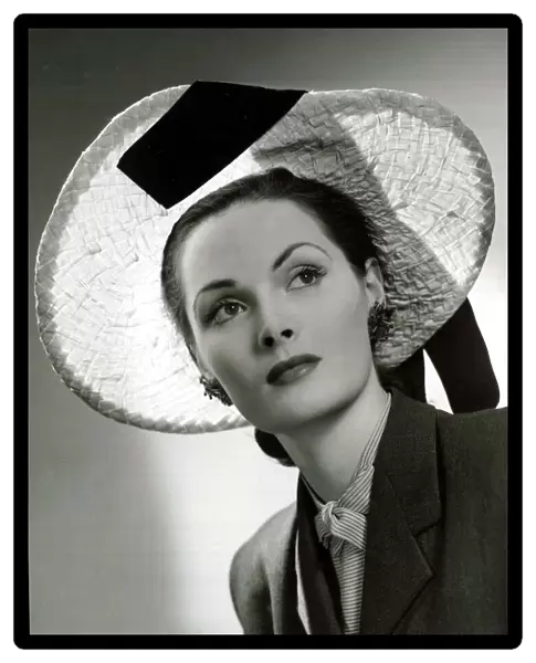 Fashion circa 1940 Natural plaited straw picture hat designed by Hugh Beresford